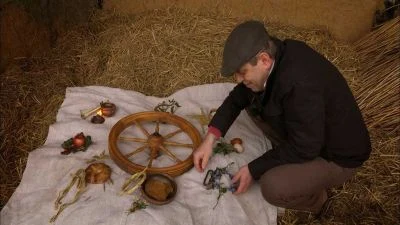 Muž s vozem na slámě při přípravě bílé soboty